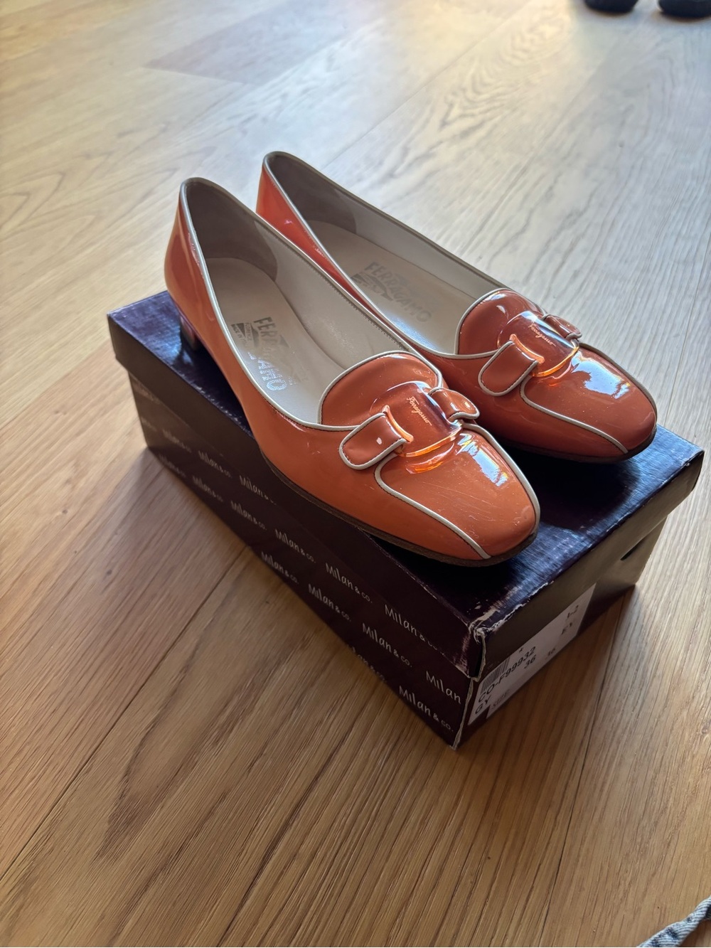 Salvatore Ferragamo orange patent leather loafers
